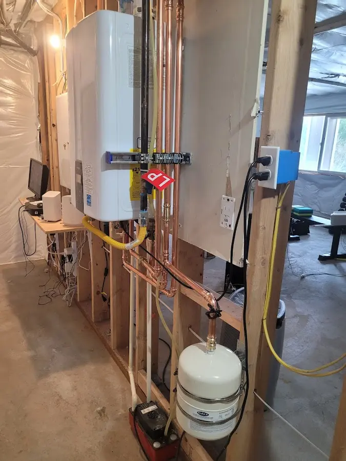 Licensed plumber repairing a kitchen sink in Melrose